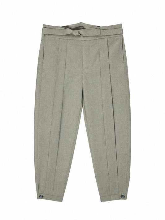 A pair of light sage light brown hakama pleated trousers with a matching fabric tie belt at the waist, displayed flat against a solid white background.