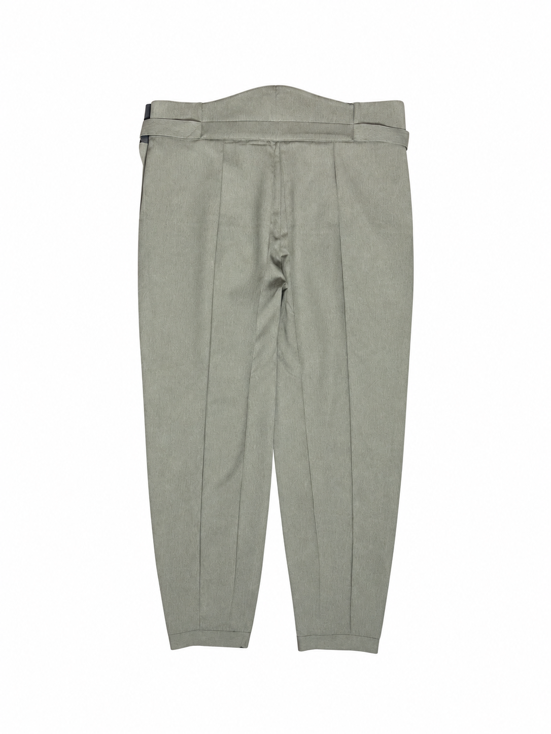 A pair of light brown
pleated hakama trousers shown flat against a solid white background.