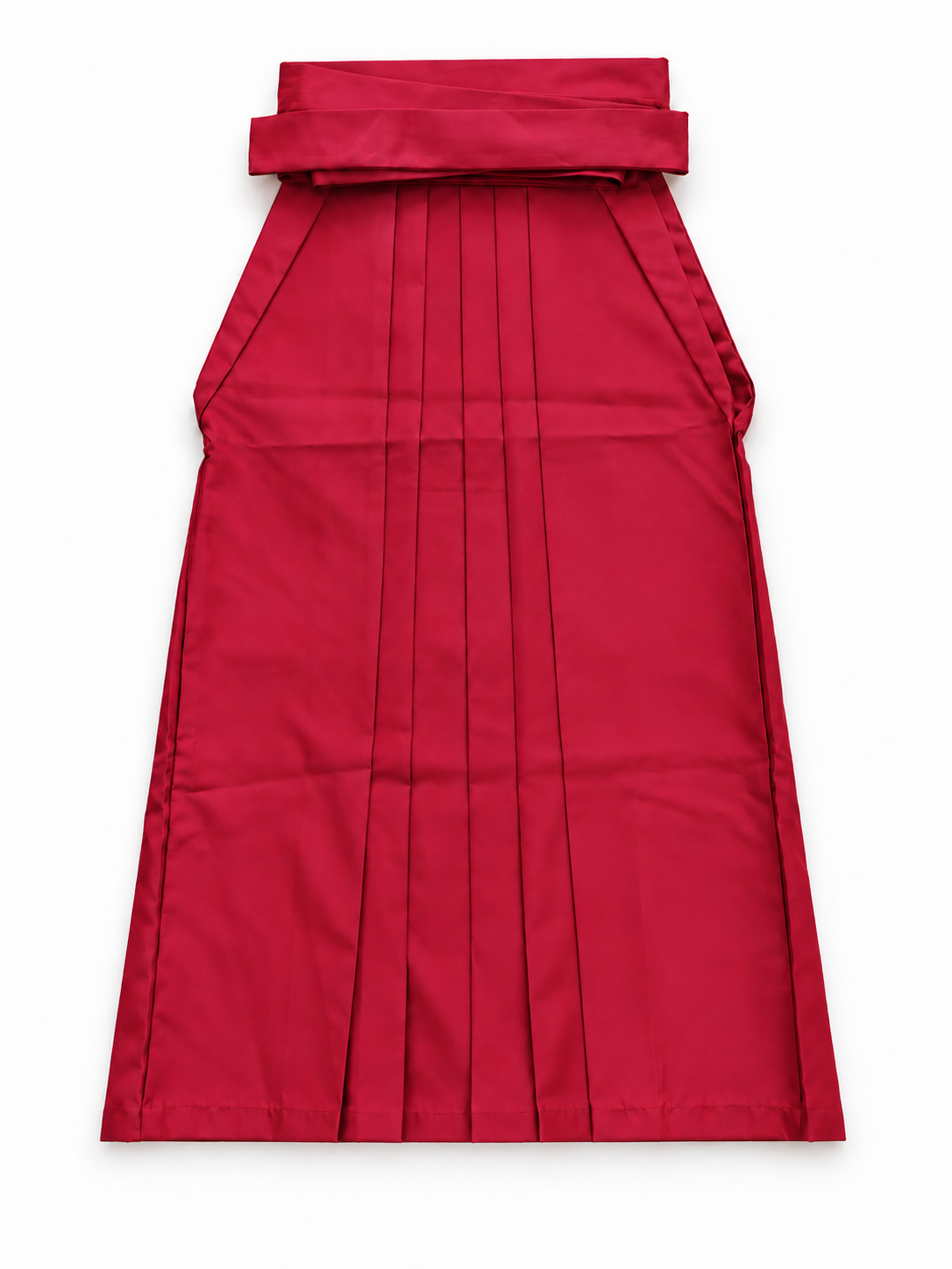 A bright red pleated traditional hakama skirt with a wide waistband and tie detail, shown flat against a white background.