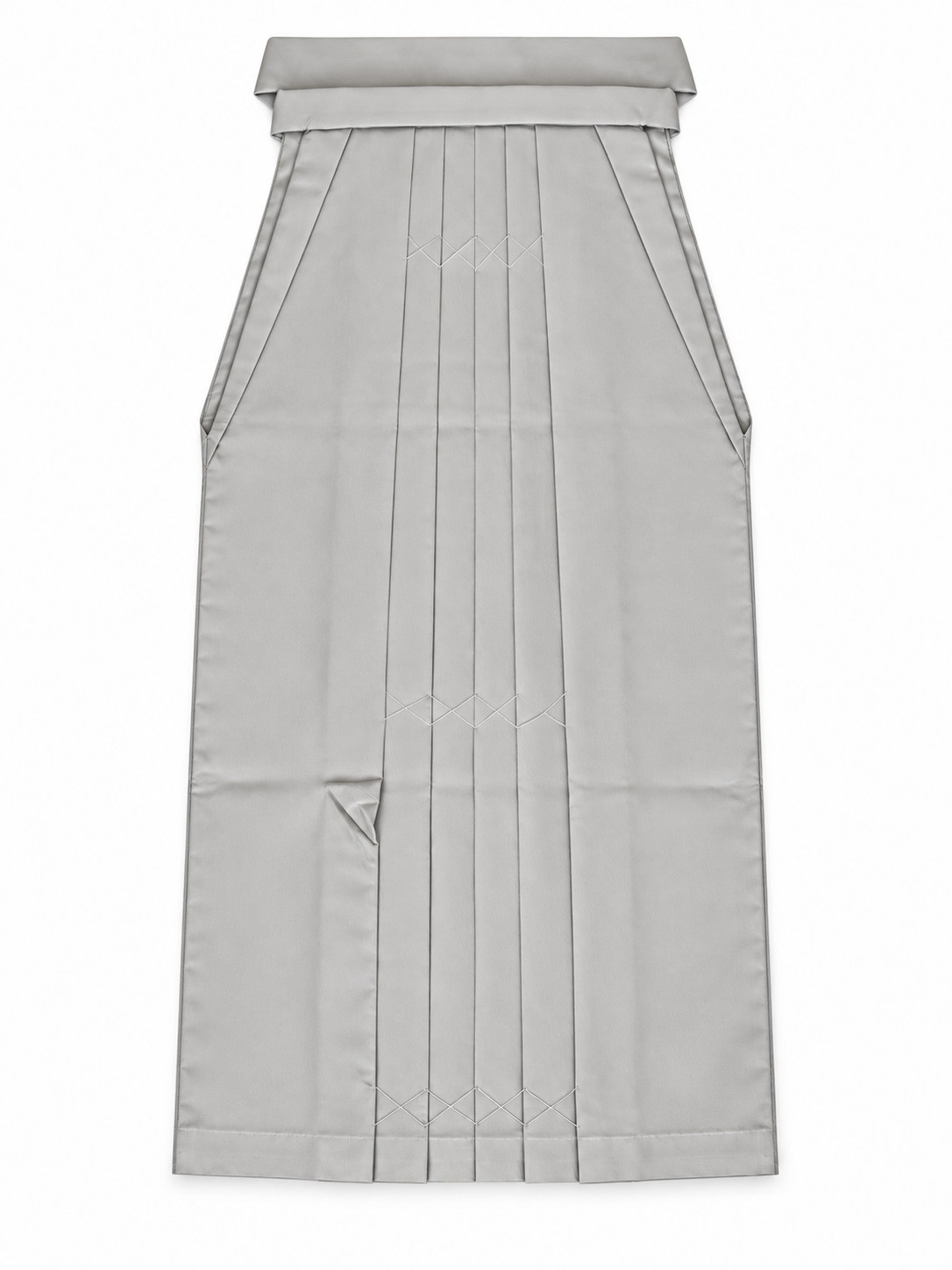 A light gray pleated traditional Japanese hakama skirt with a structured waistband and front pleats, shown flat against a white background.